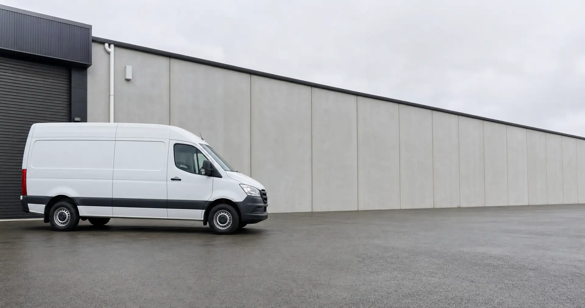 A panel van parked side-on with its rear doors closed